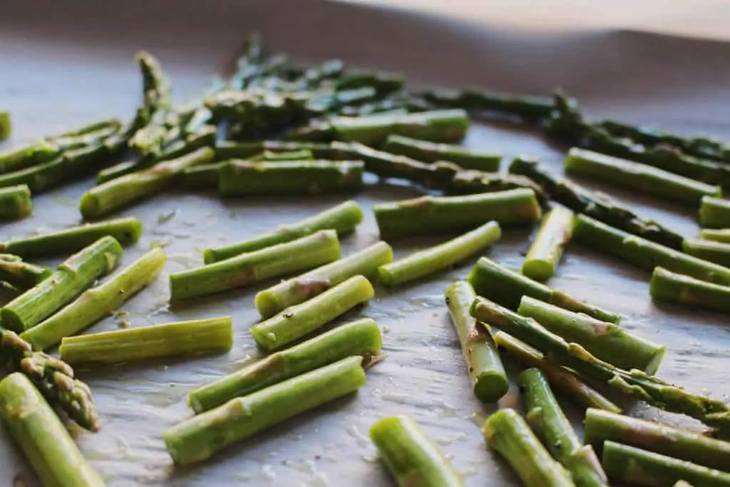 asparagus on baking sheet for roasted winter salad