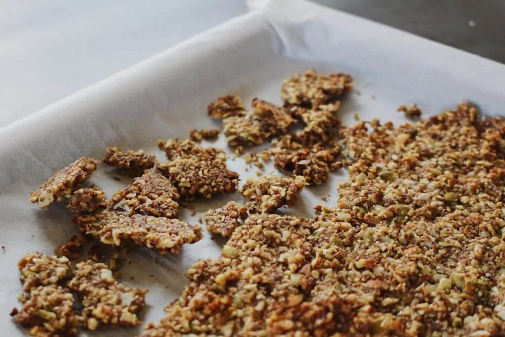 grain-free pumpkin granola crumbled on sheet pan