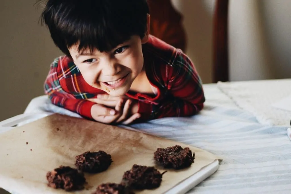 Maverick at table above no-bake chocolate cookies