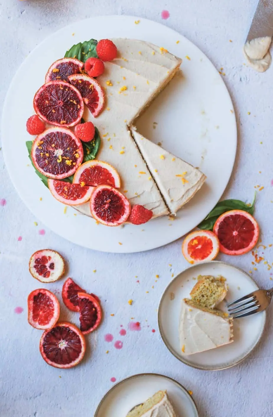 blood orange almond cake with cashew buttercream being served