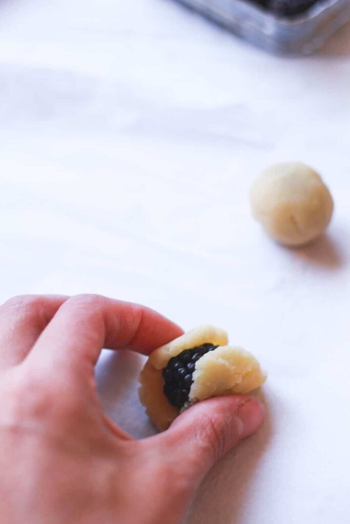 wrapping a blackberry in keto marzipan