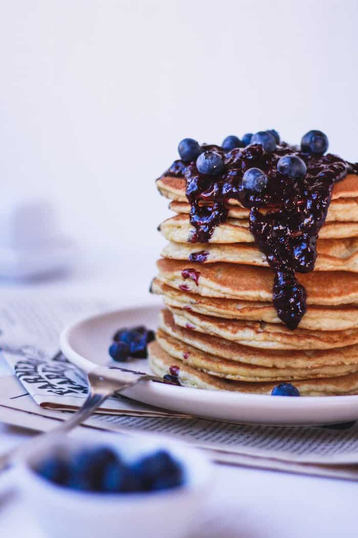 stack of almond flour pancakes with blueberry sauce