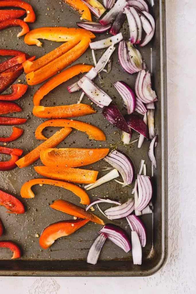 overhead of roasted vegetables on a baking sheet