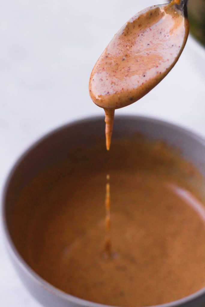 spicy peanut sauce on a spoon