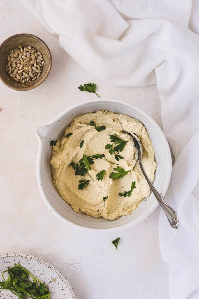 sunflower cashew ricotta in a bowl with a napkin