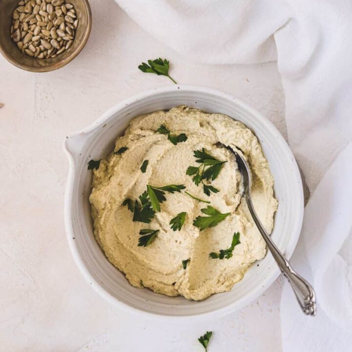 sunflower cashew ricotta in a bowl with a napkin