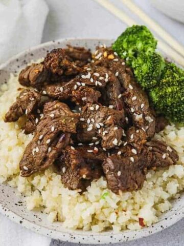 Low-carb beef bulgogi on a plate with cauliflower rice