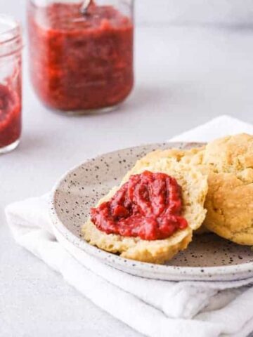 low-carb strawberry rhubarb chia jam spread on a biscuit half