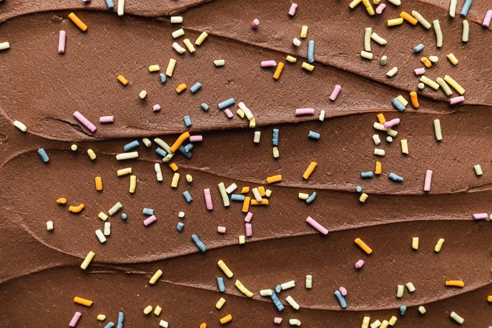 overhead shot of keto chocolate frosting with sprinkles