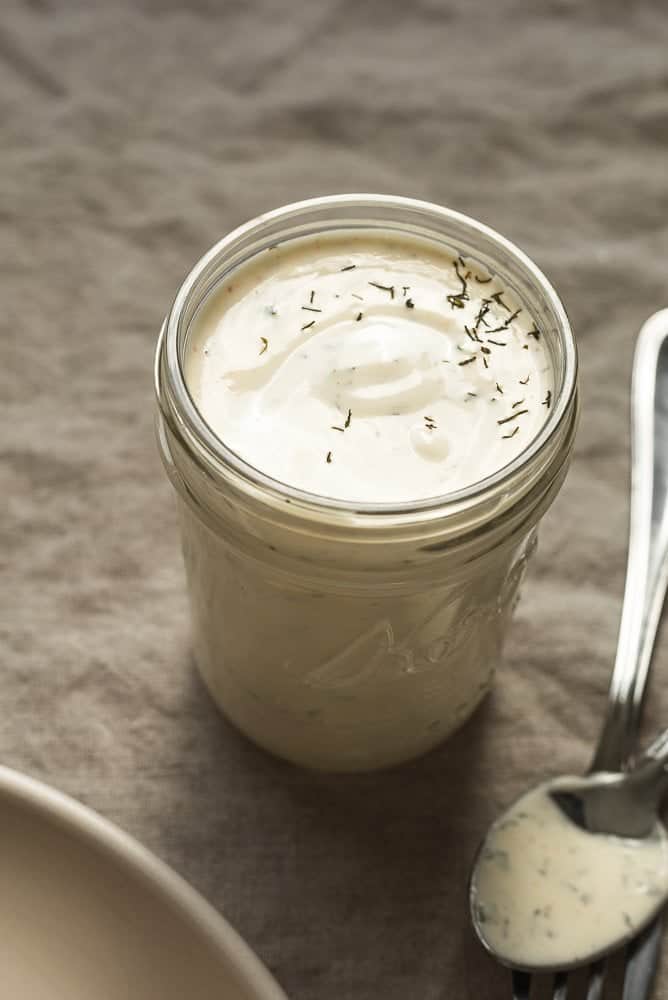 Creamy keto ranch dressing in a mason jar.