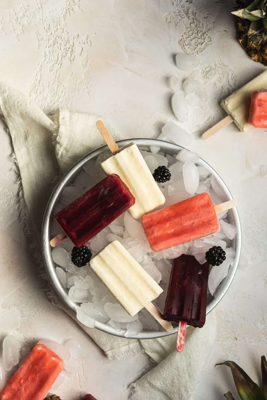 overhead of keto popsicles in a tray with ice and a napkin