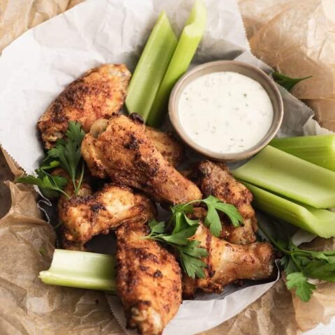 keto air fryer chicken wings on a plate with celery