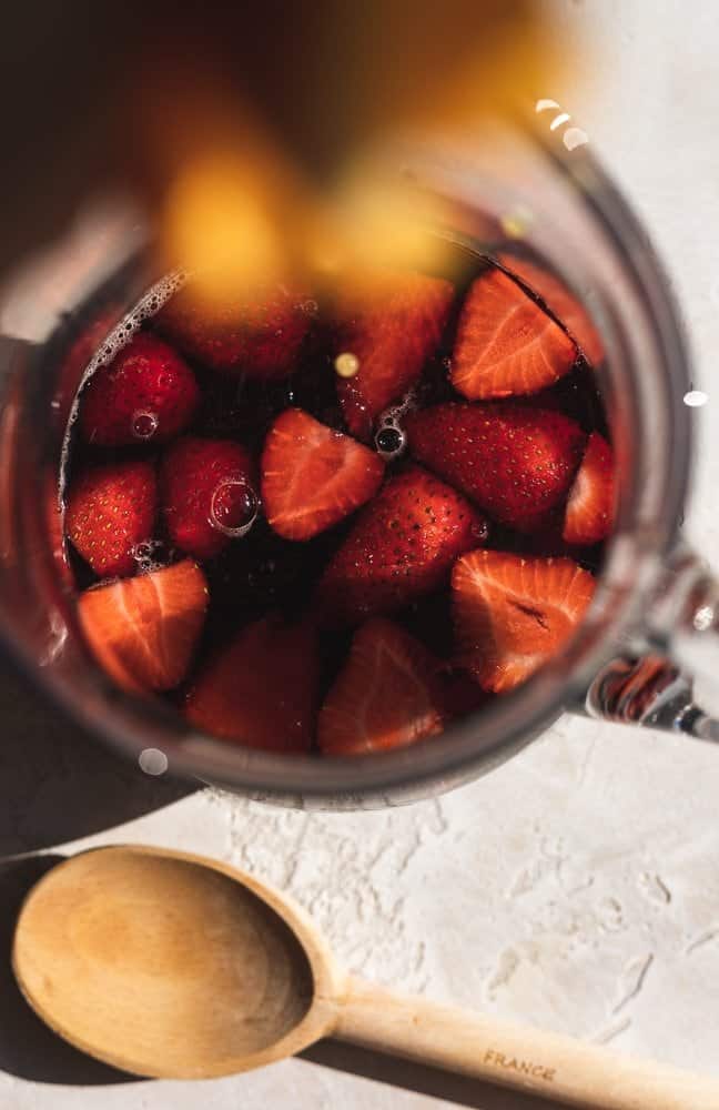 squeezing orange juice into low-carb red sangria