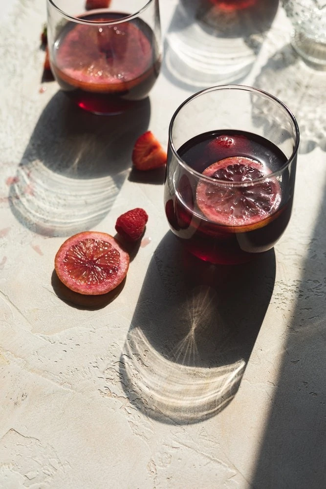 glasses of low-carb sangria with shadows from glass
