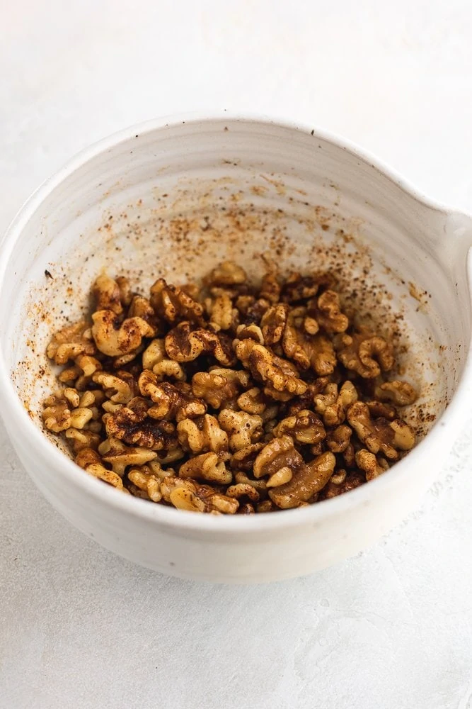 walnuts with spices in a bowl