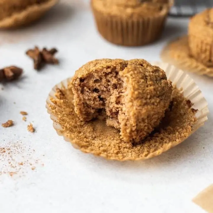 shot of a bite taken out of a keto cinnamon muffin
