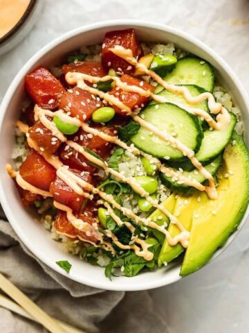 keto poke bowl with other dishes around it