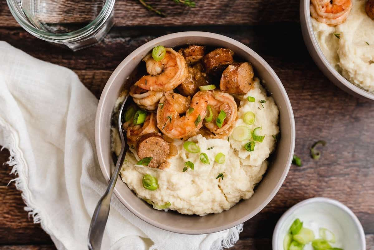 keto shrimp and grits with green onions in a bowl