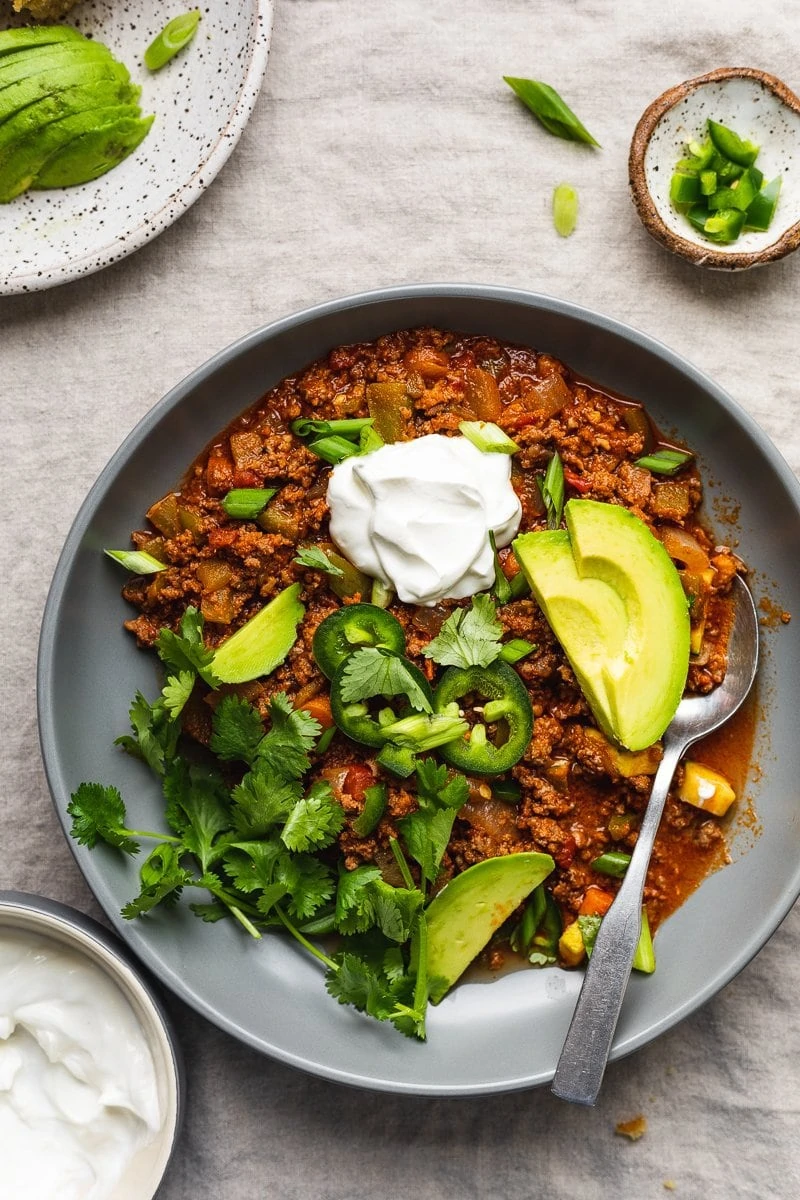 keto chili in a bowl with toppings