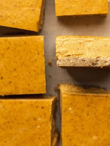 closeup shot of the edge of a keto pumpkin cheesecake bar