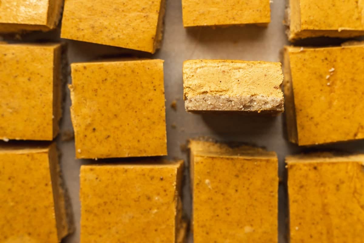 closeup shot of the edge of a keto pumpkin cheesecake bar