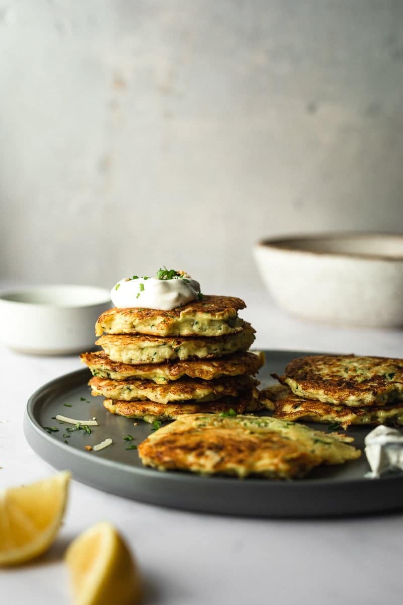 A stack of keto zucchini fritters on a plate.