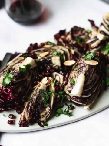 radicchio wedge salad on platter with toppings
