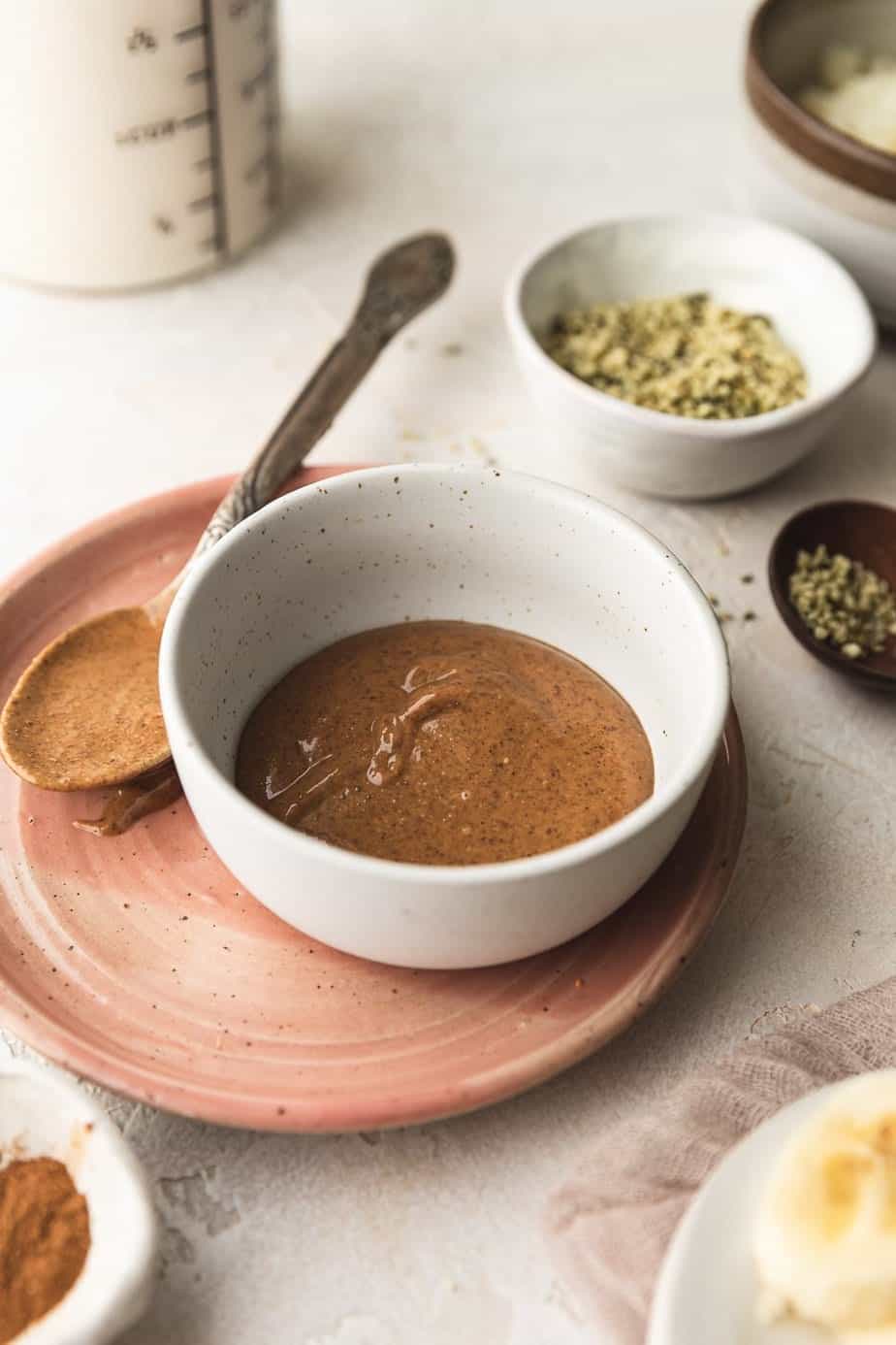 shot of almond butter in a dish with other smoothie ingredients