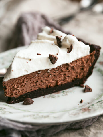A slice of keto French silk pie on a vintage plate.