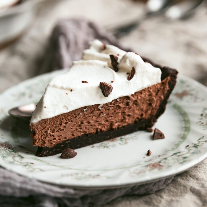 A slice of keto French silk pie on a vintage plate.