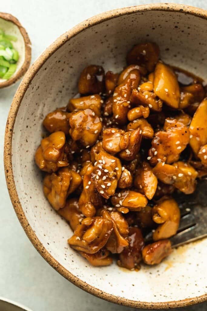 bourbon chicken pieces with sesame seeds