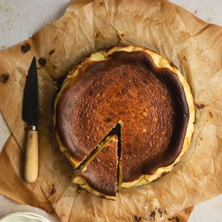 whole Basque burnt cheesecake with a slice cut out