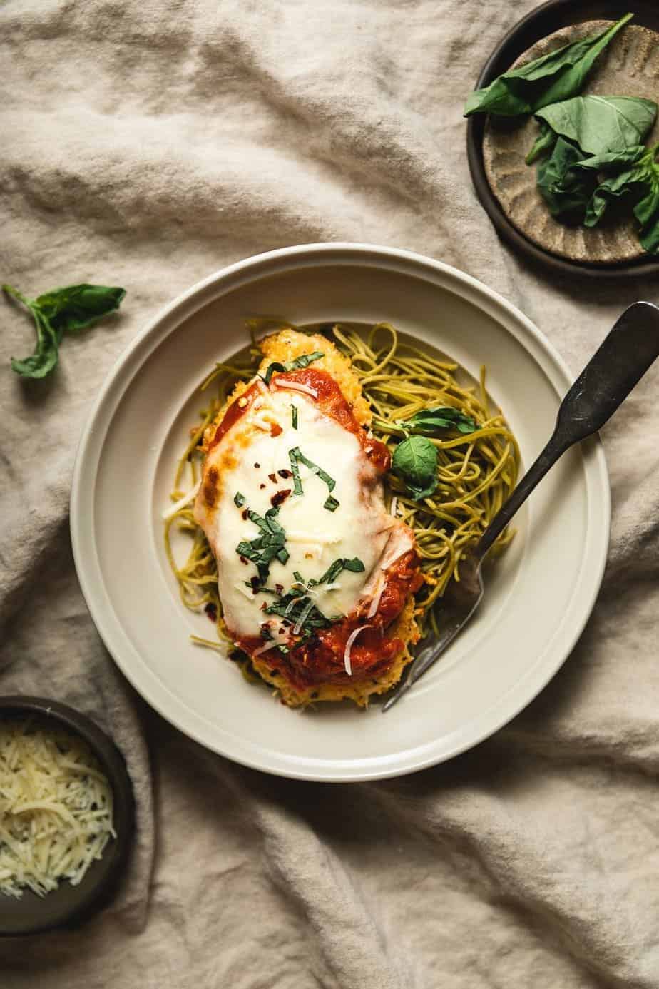 Keto chicken parmesan on a bed of low-carb noodles.