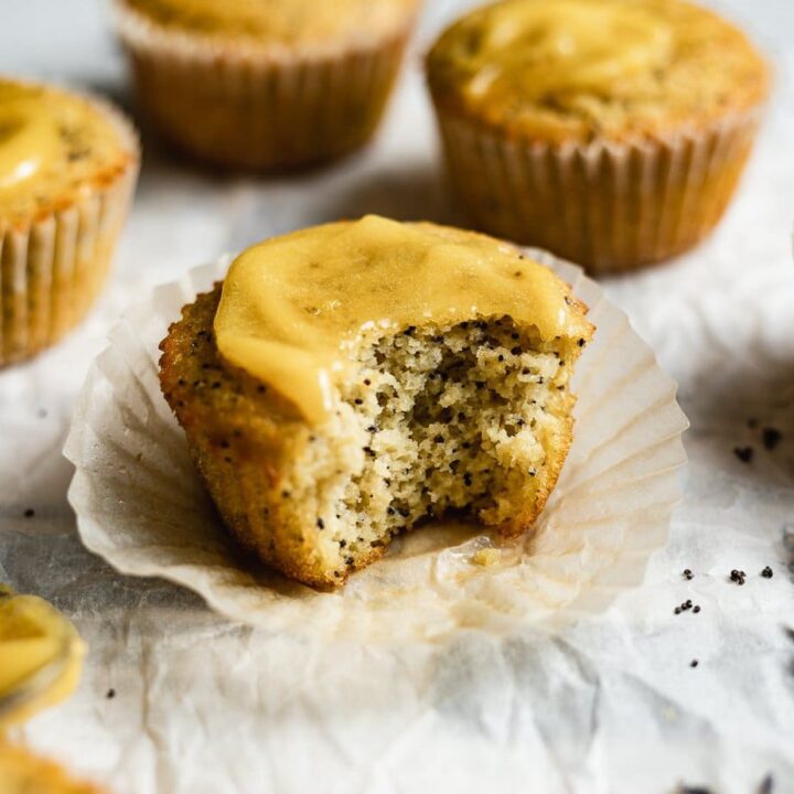 horizontal image of a bite taken out of a coconut flour muffin