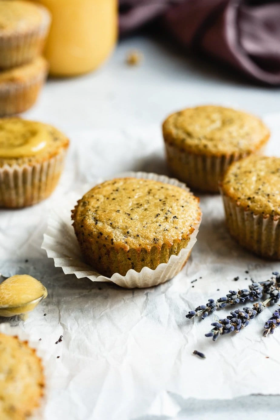 keto lemon poppy seed muffins with lavender in the foreground