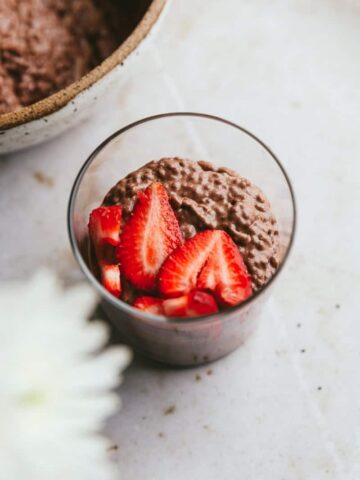 keto chocolate chia pudding with strawberries in a glass
