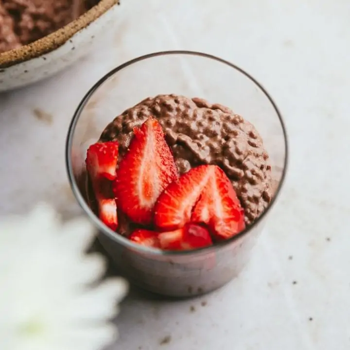 keto chocolate chia pudding with strawberries in a glass