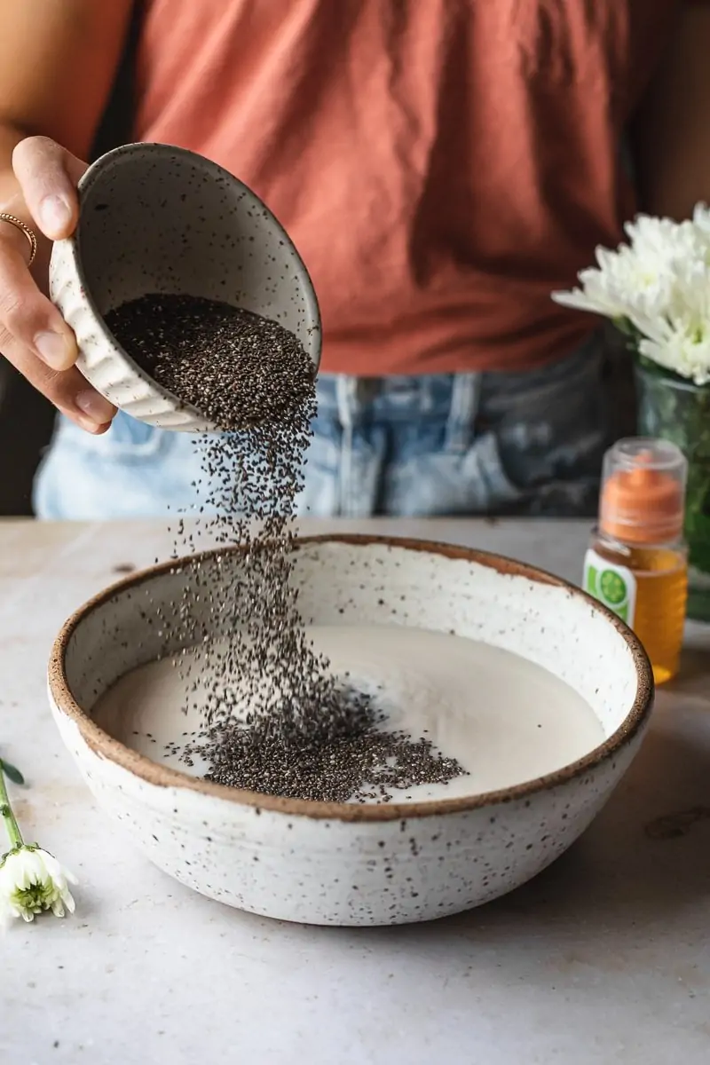 pouring chia seeds into a bowl