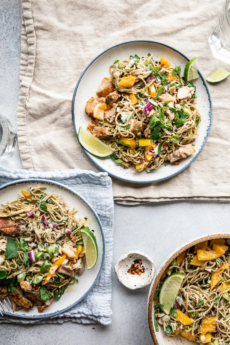 two plates with low-carb cold noodle salad on linens