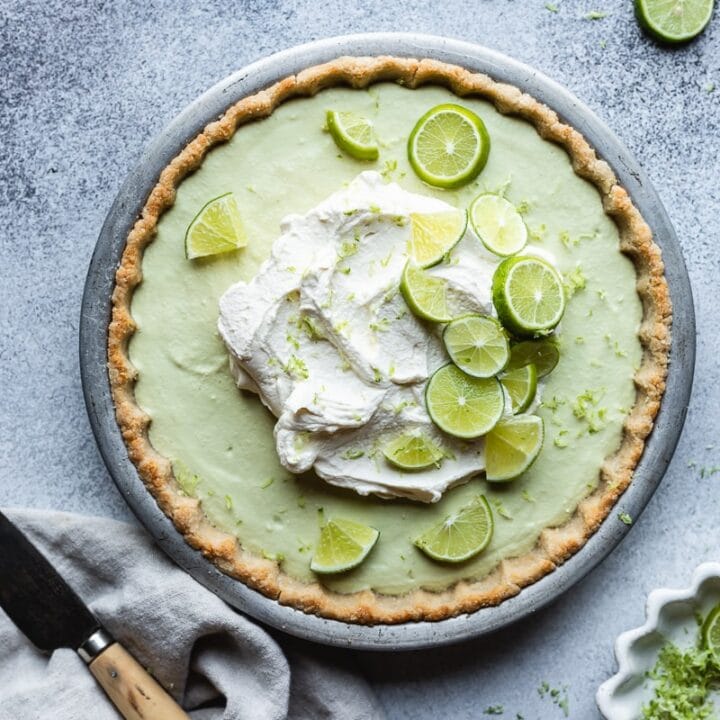 keto key lime pie with lime slices, a linen and knife