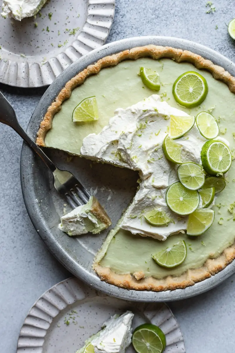 overhead image of keto key lime pie with a slice cut out