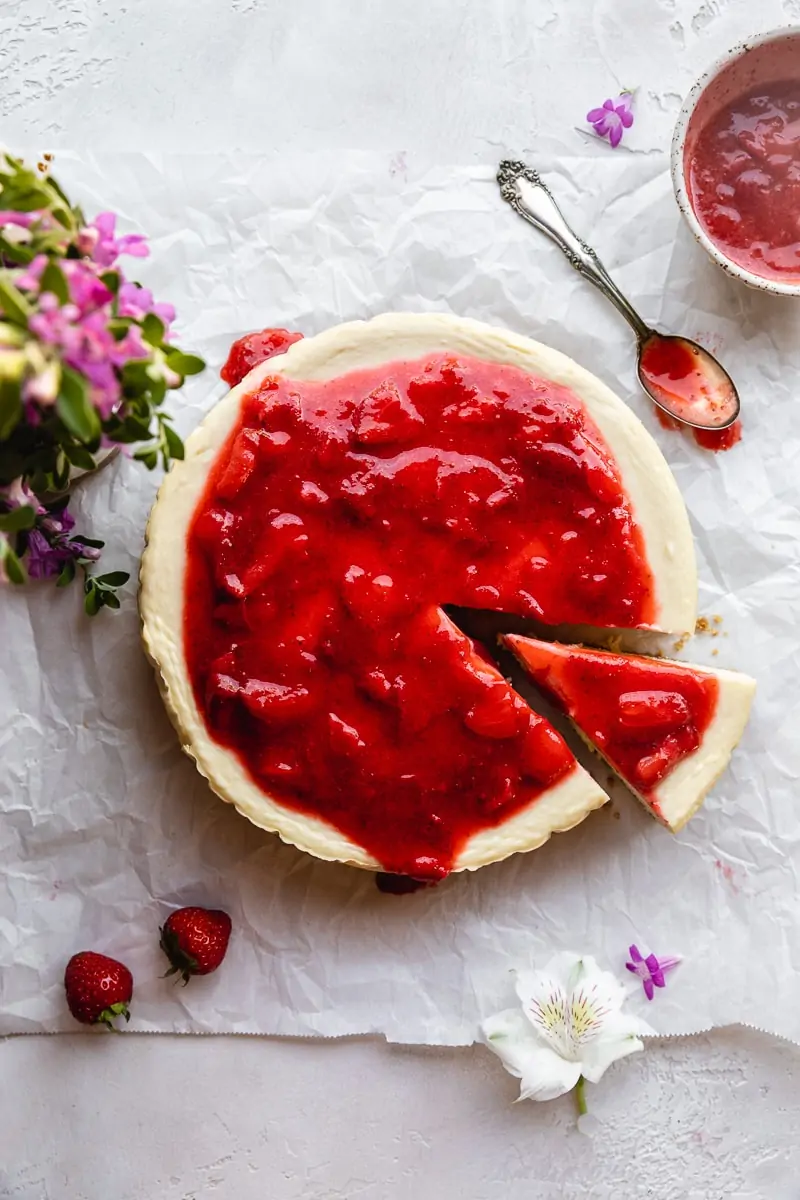 overhead of whole keto cheesecake with strawberry topping