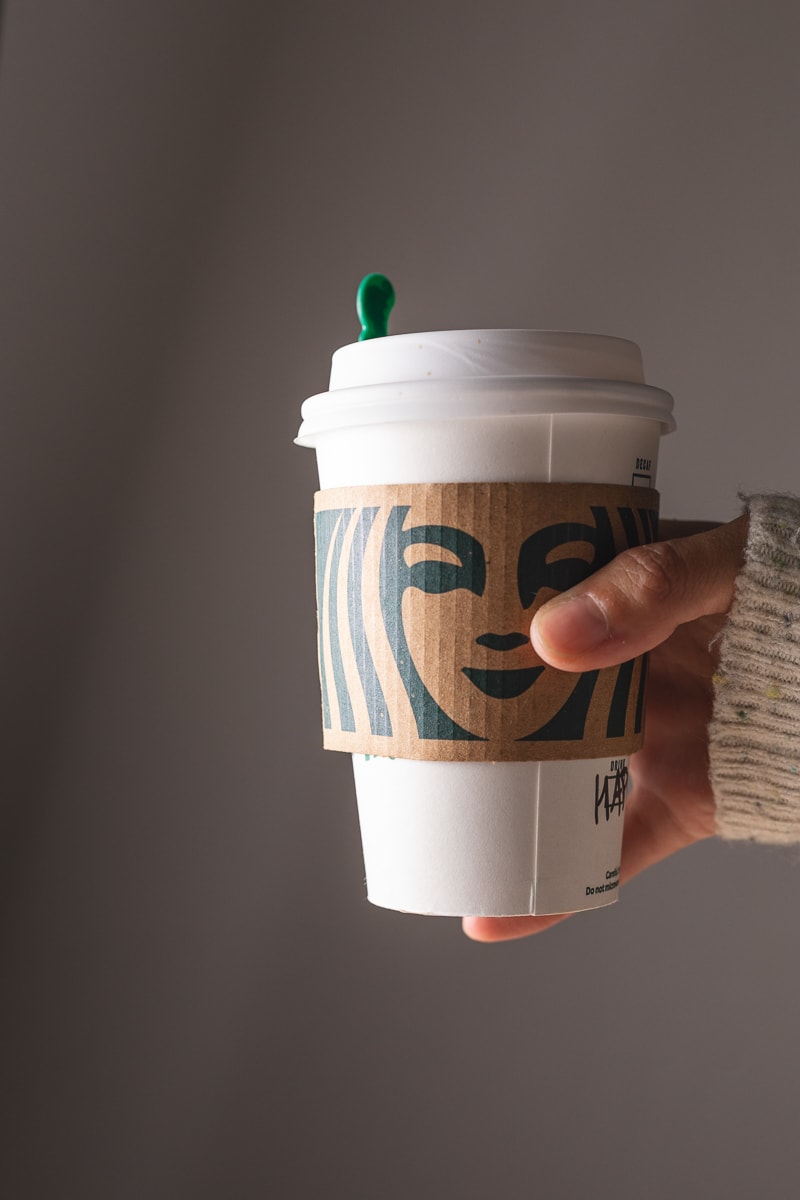 holding a hot keto Starbucks drink