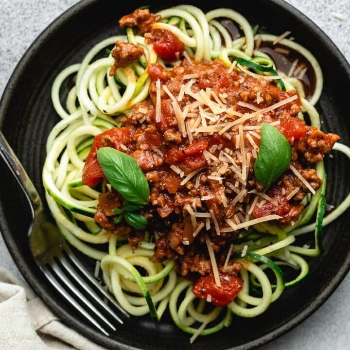 low carb spaghetti sauce with zoodles on a black plate