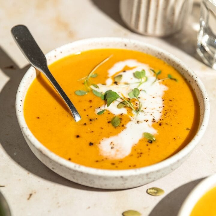 bowl of keto pumpkin soup with coconut cream