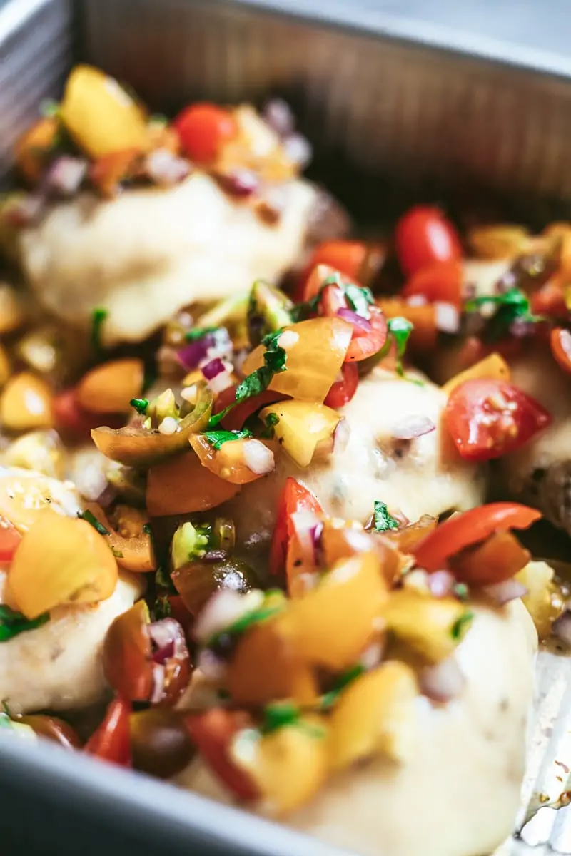 Bruschetta chicken bake in a casserole dish. 