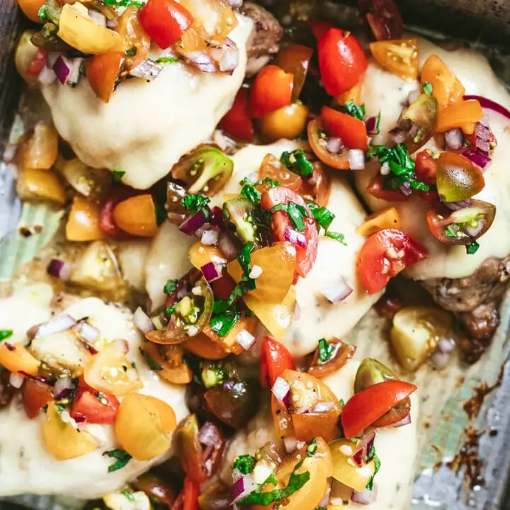 low-carb bruschetta chicken with tomato topping in pan