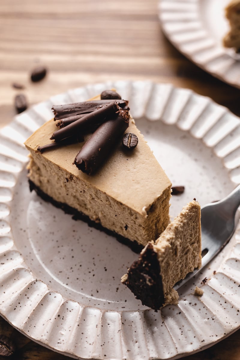 keto coffee cheesecake slice with a bite on a fork