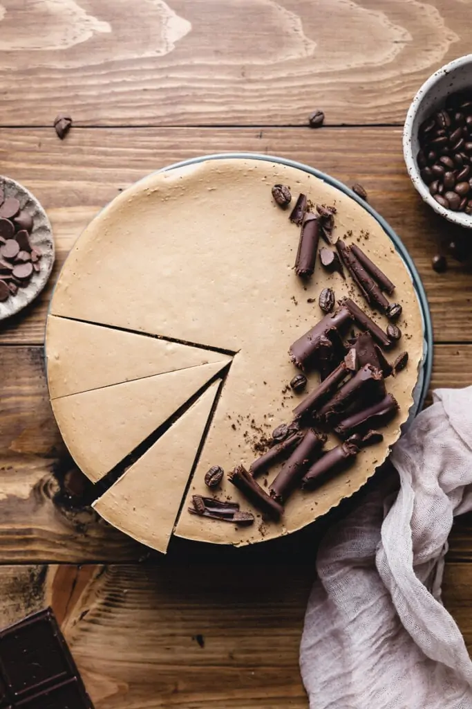 whole keto coffee cheesecake with slices cut