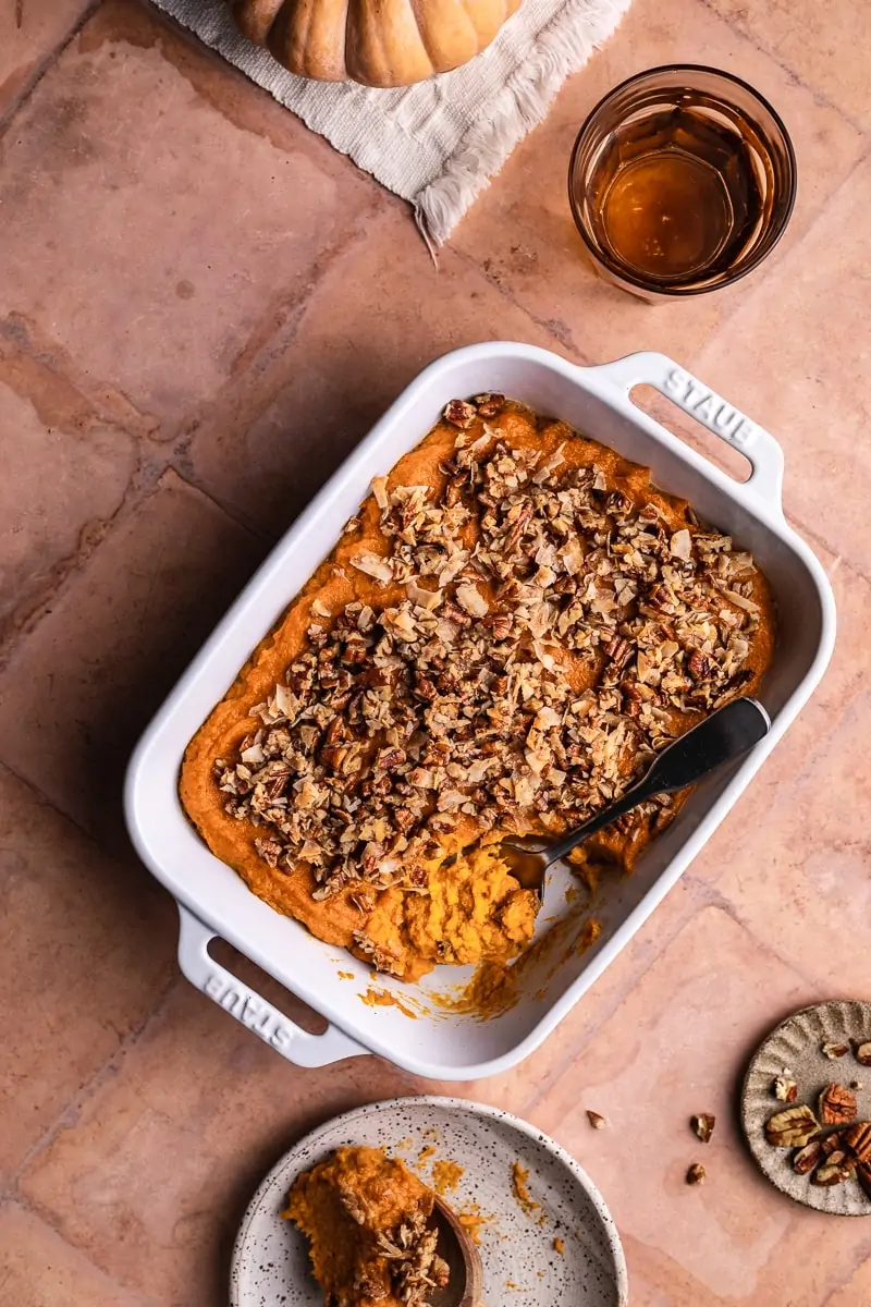 keto sweet potato casserole in a baking dish with a spoon